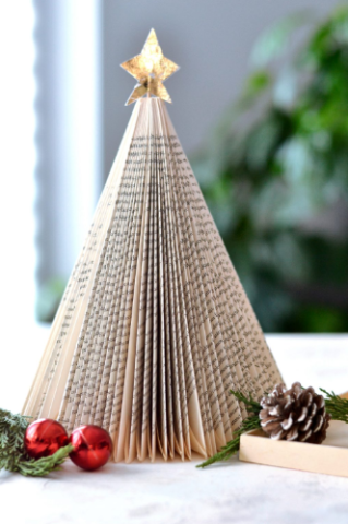 photo of a decorated tree made out of books