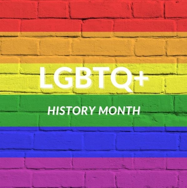 bricks painted rainbow with LGBTQ+ history month words